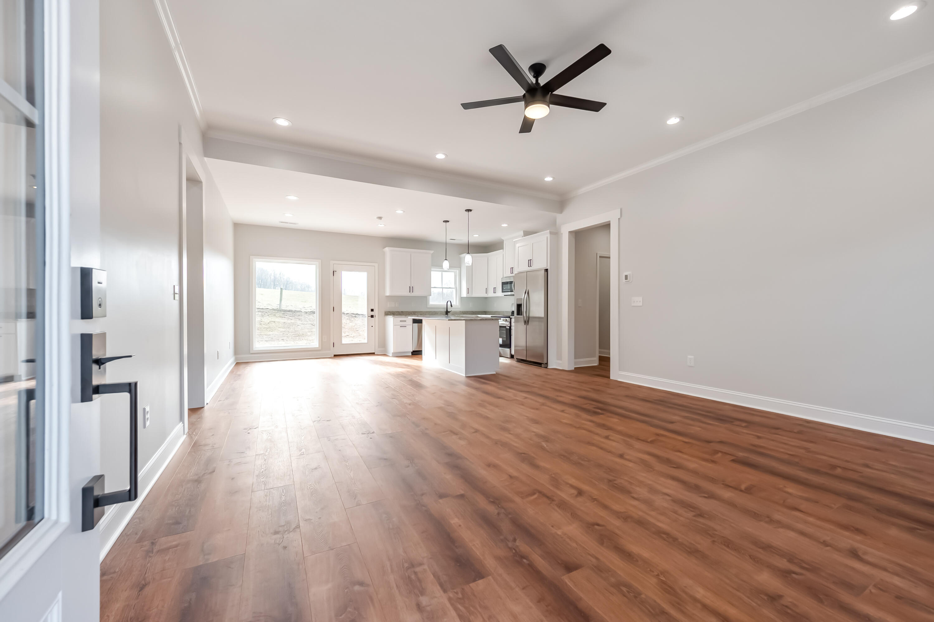 1047 Barberry Road Southeast Floyd, VA 24091 - Photo 7 of 50 a view of a livingroom with a hardwood floor and a ceiling fan