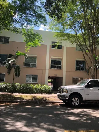 a view of a cars parked in front of a house