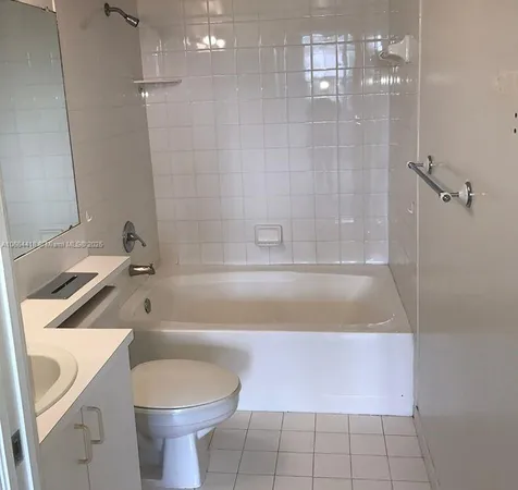 a kitchen with stainless steel appliances granite countertop a sink a stove a microwave and cabinets