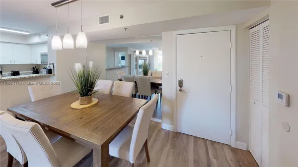 a living room with couches and painting on the wall