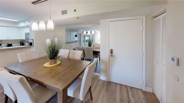 a living room with couches and painting on the wall