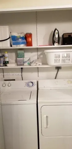 a front view of building with yard