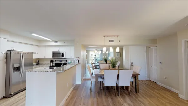 a view of a balcony with outdoor seating