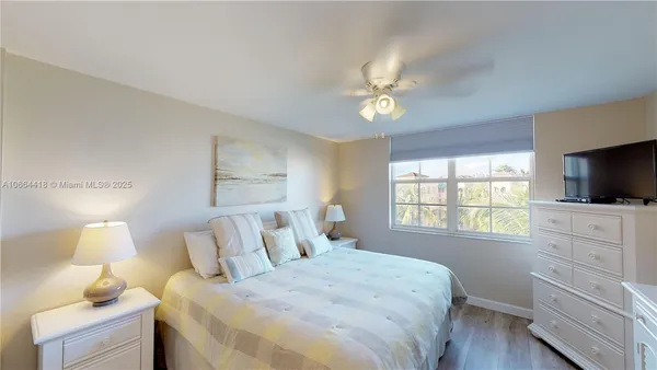 a bathroom with a tub and shower