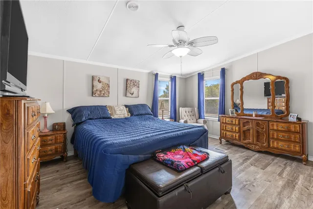 a bedroom with a bed and a dresser in it