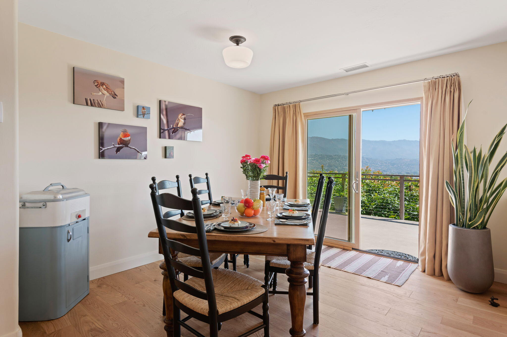 Undisclosed Address Santa Barbara, CA 93109 - Photo 11 of 30 a dining room with furniture large windows and wooden floor