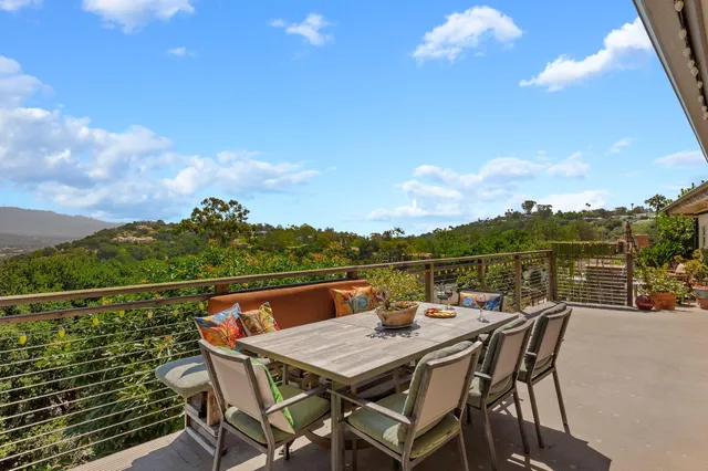a view of a terrace with furniture