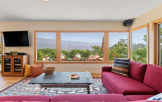 a living room with furniture and a flat screen tv