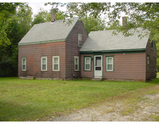 185 Wareham Road Marion, MA 02738 - Photo 1 of 1 a brick house with a yard