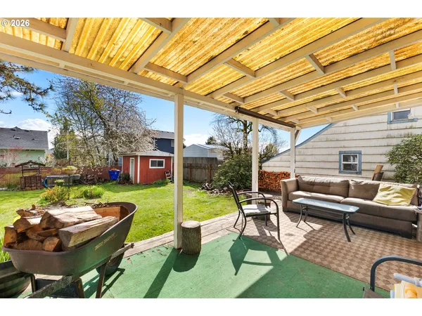a swimming pool with outdoor seating and yard