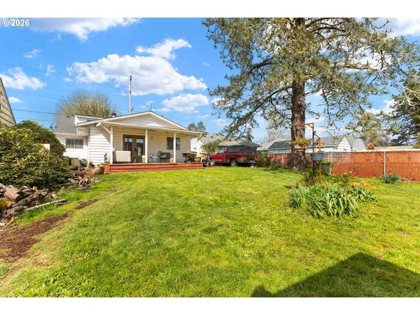 a view of a house with a big yard