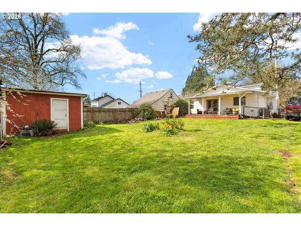 a view of a house with a big yard