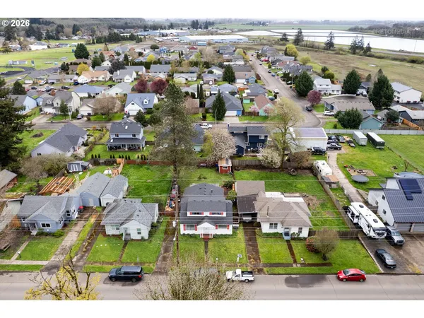 an aerial view of a houses with a swimming pool