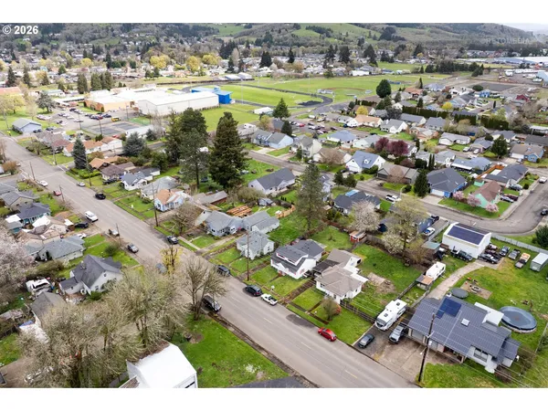 an aerial view of lake residential houses with outdoor space and swimming pool