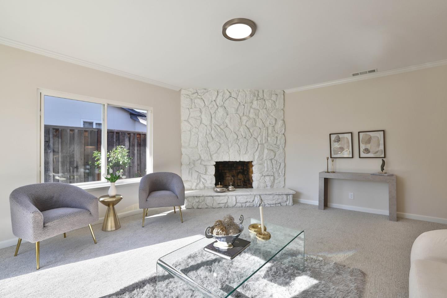 889 Ebbetts Drive Campbell, CA 95008 - Photo 14 of 33 a living room with furniture and a fireplace
