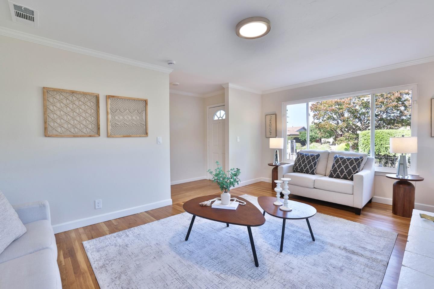 889 Ebbetts Drive Campbell, CA 95008 - Photo 15 of 33 a living room with furniture and a wooden floor