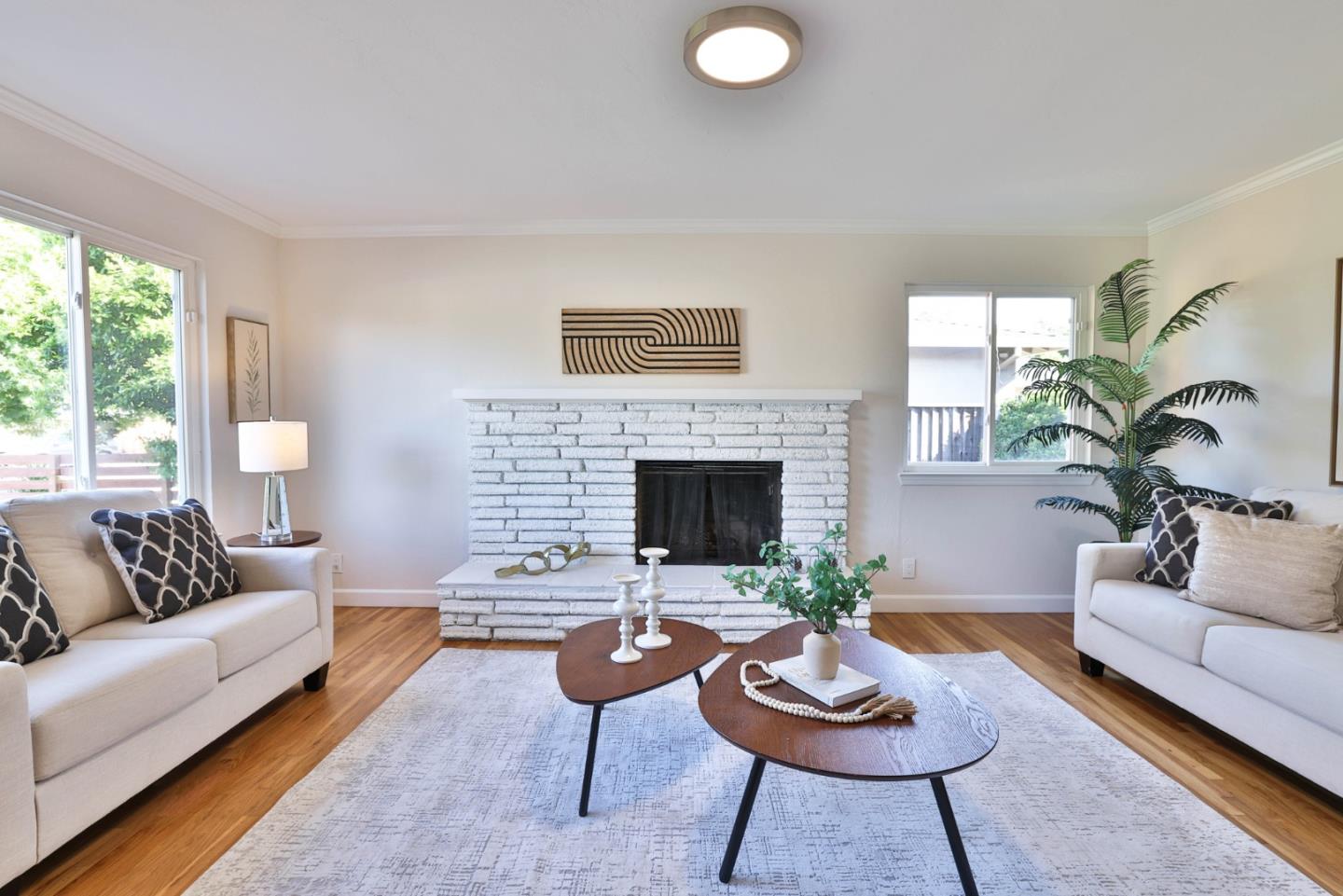 889 Ebbetts Drive Campbell, CA 95008 - Photo 16 of 33 a living room with furniture and a fireplace