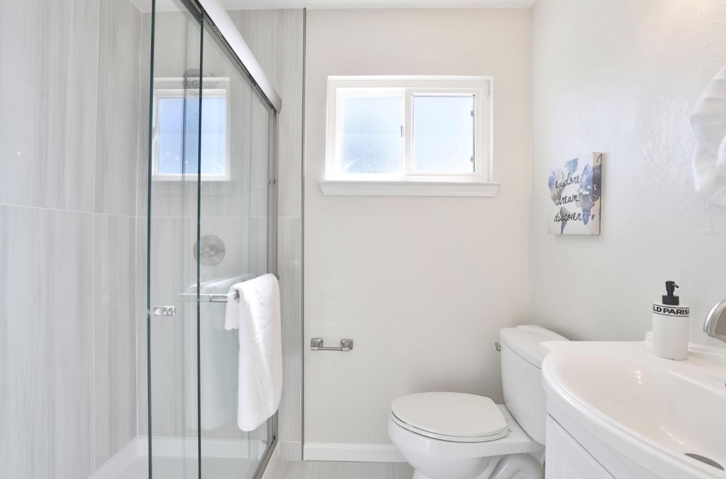 889 Ebbetts Drive Campbell, CA 95008 - Photo 19 of 33 a white toilet sitting next to a bathroom sink