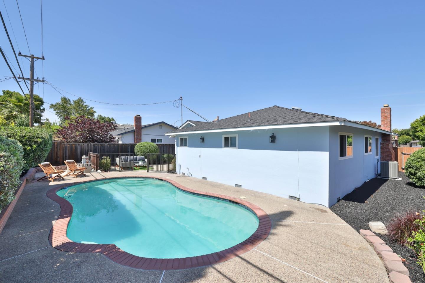 889 Ebbetts Drive Campbell, CA 95008 - Photo 25 of 33 a view of a house with a yard and sitting area