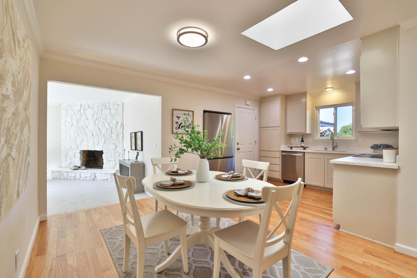 889 Ebbetts Drive Campbell, CA 95008 - Photo 9 of 33 a view of a dining room and livingroom with furniture wooden floor and a rug