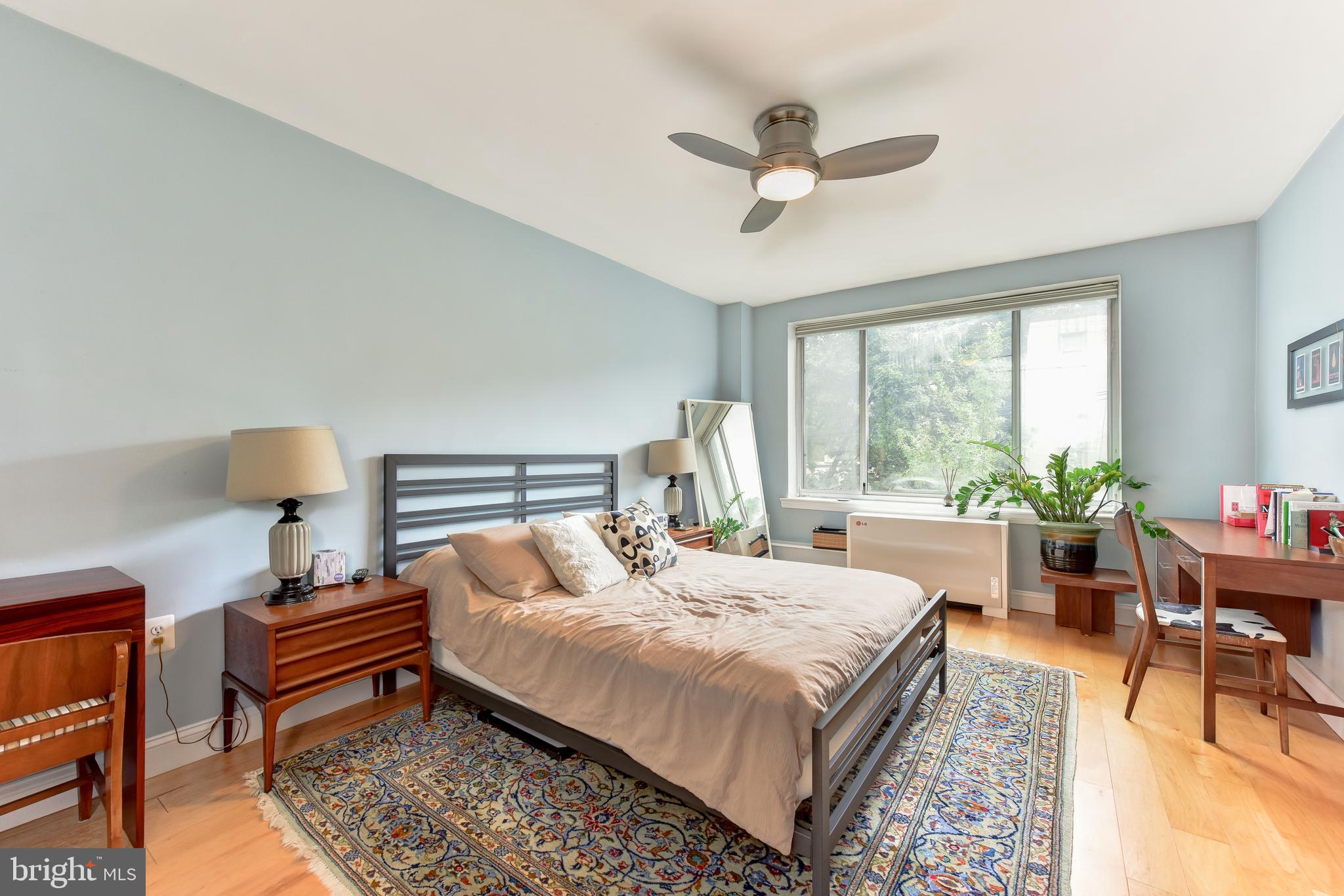 4100 W Street Northwest, Unit 510 Washington, DC 20007 - Photo 11 of 22 a bedroom with a bed and a chandelier