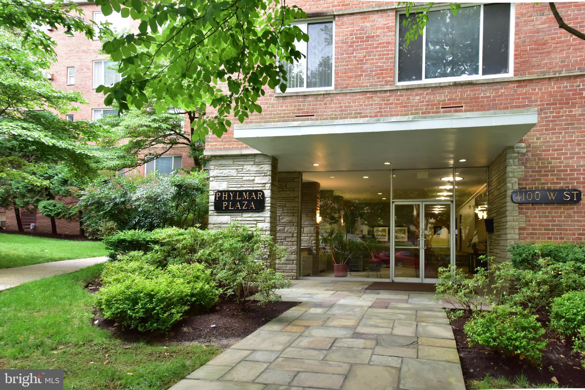 4100 W Street Northwest, Unit 510 Washington, DC 20007 - Photo 18 of 22 a front view of a house with garden