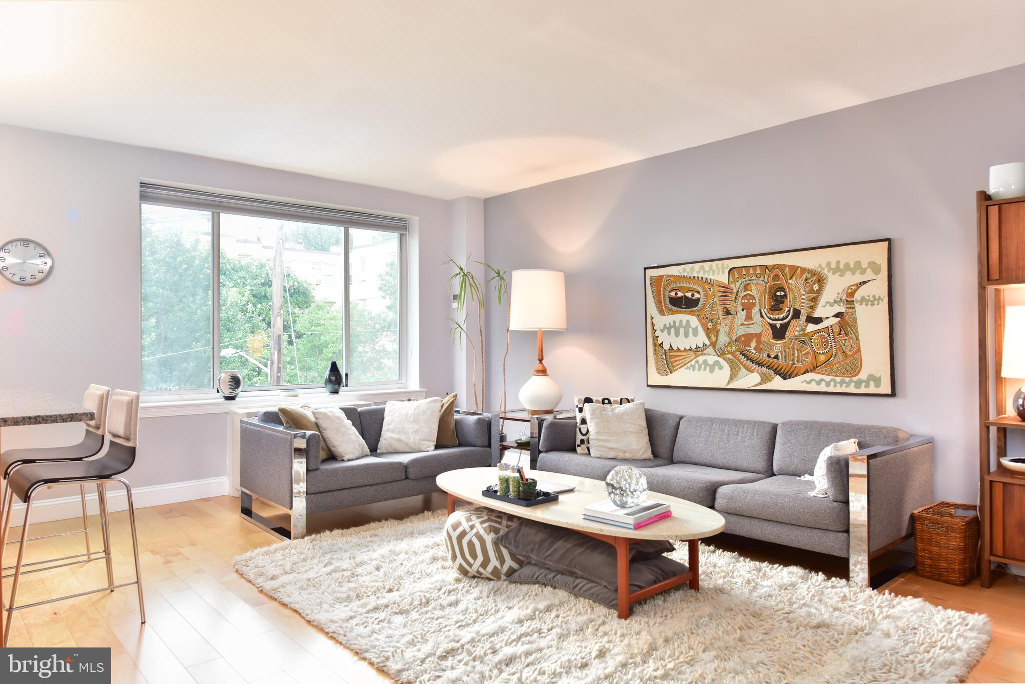 4100 W Street Northwest, Unit 510 Washington, DC 20007 - Photo 4 of 22 a living room with furniture and a large window