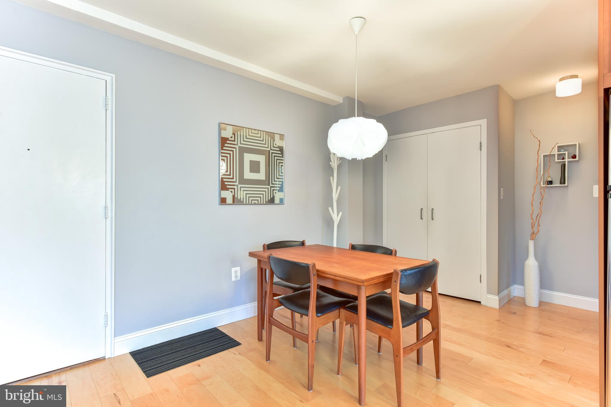 4100 W Street Northwest, Unit 510 Washington, DC 20007 - Photo 6 of 22 a dining room with furniture and wooden floor