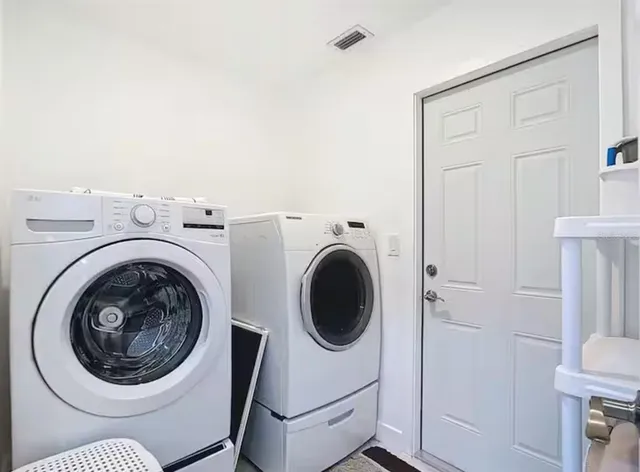 a utility room with dryer and washer