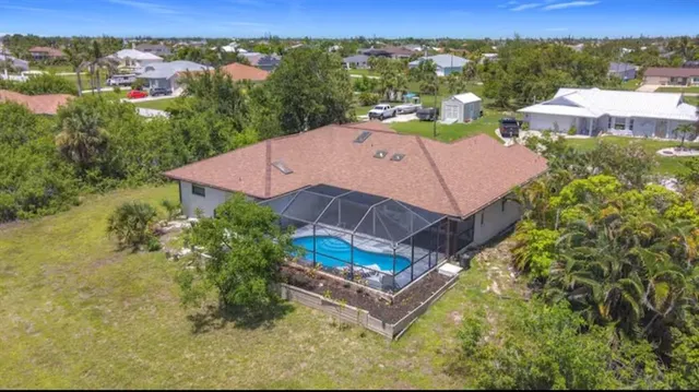 an aerial view of a house with a garden