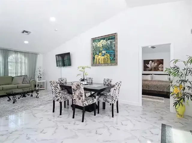 a view of a dining room with furniture