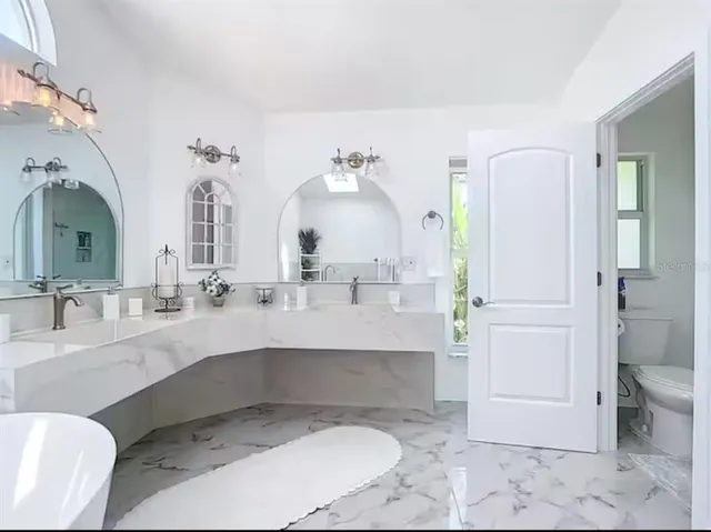 a bathroom with a sink and toilet