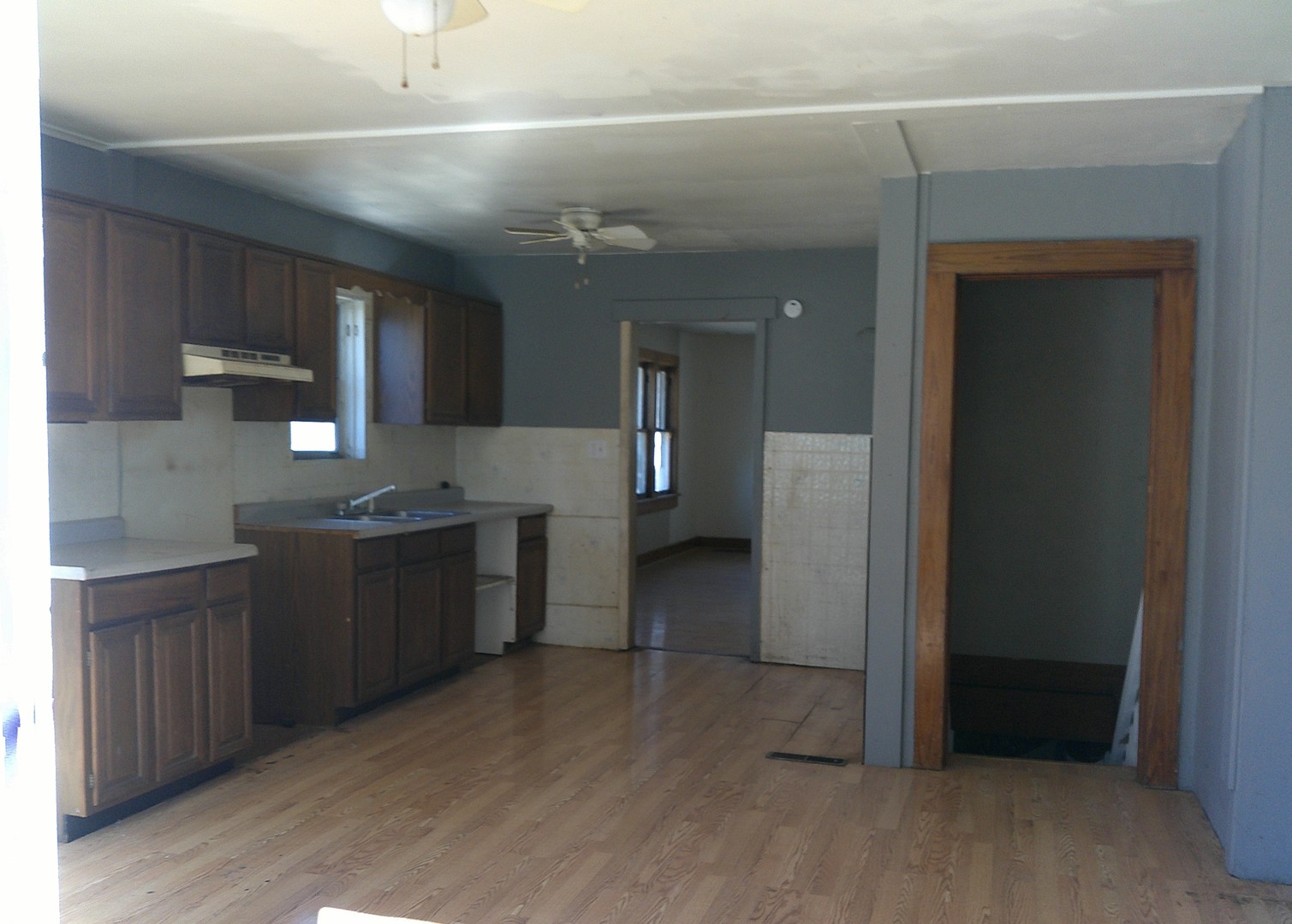 115 West 8th Street St. Elmo, IL 62458 - Photo 3 of 7 a kitchen with a refrigerator and a sink