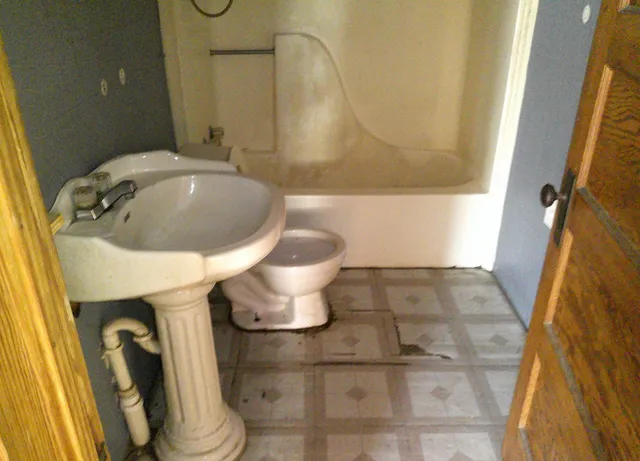 a bathroom with a sink and mirror