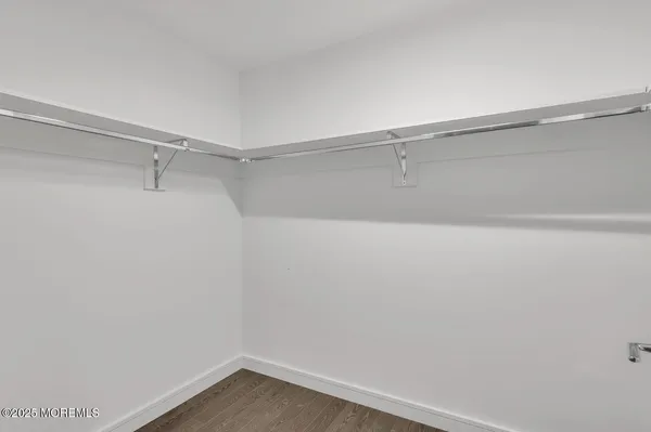 a view of an empty walk in closet