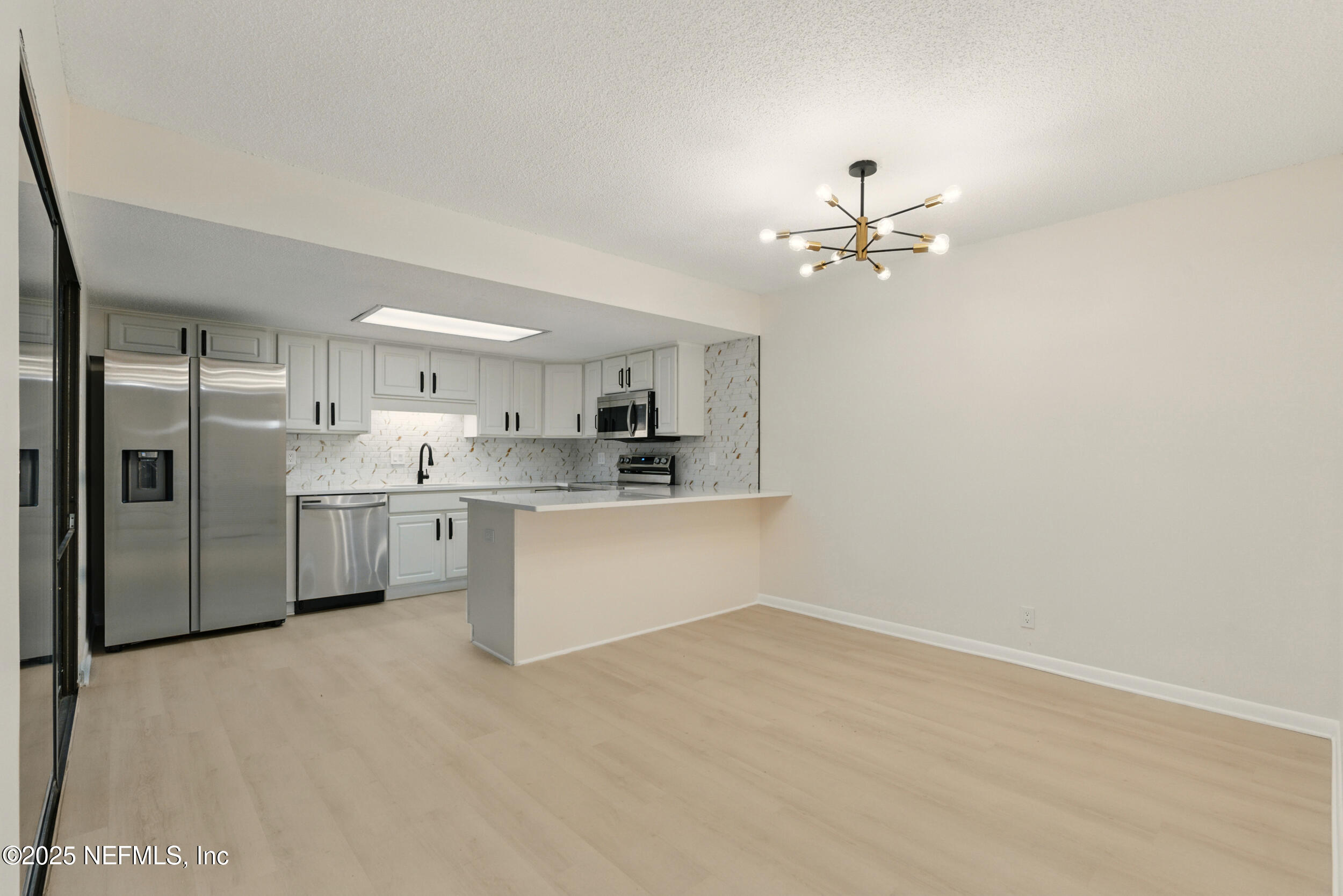 10341 Big Tree Terrace Jacksonville, FL 32257 - Photo 6 of 39 Dining Room and Kitchen