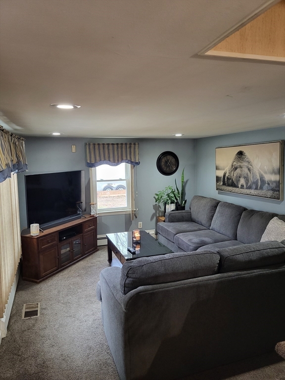 4 Narrows Road Assonet, MA 02702 - Photo 9 of 15 a living room with furniture and a flat screen tv
