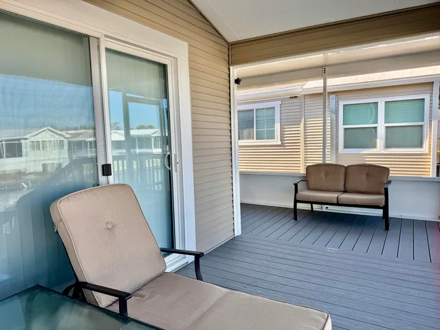 a view of staircase with a large window and wooden floor
