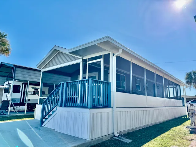 a view of a house with wooden stairs