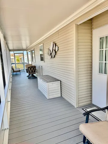a bedroom with a bed and large window