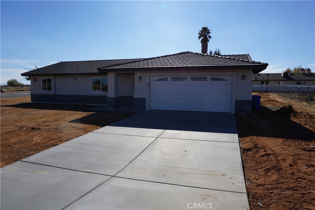 20275 Rimrock Road East Apple Valley, CA 92307 - Photo 1 of 1 a front view of a house with a yard
