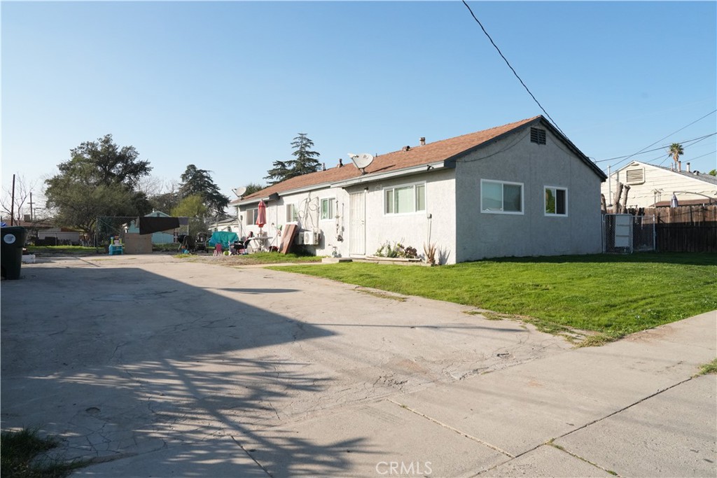 230 North Millard Avenue Rialto, CA 92376 - Photo 2 of 10 a front view of house with yard and green space