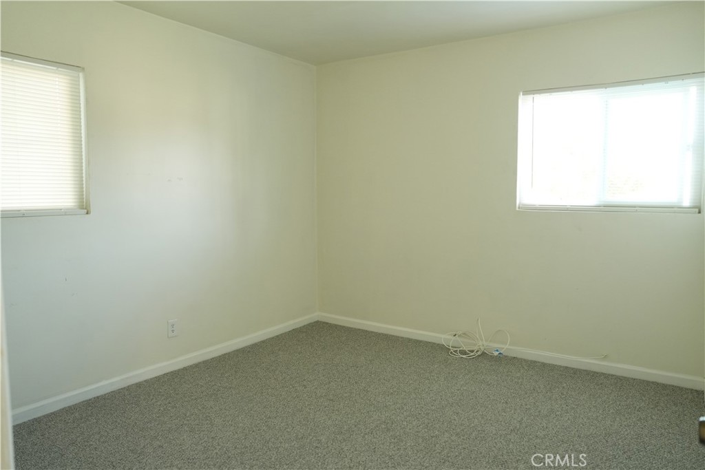 230 North Millard Avenue Rialto, CA 92376 - Photo 3 of 10 an empty room with a window