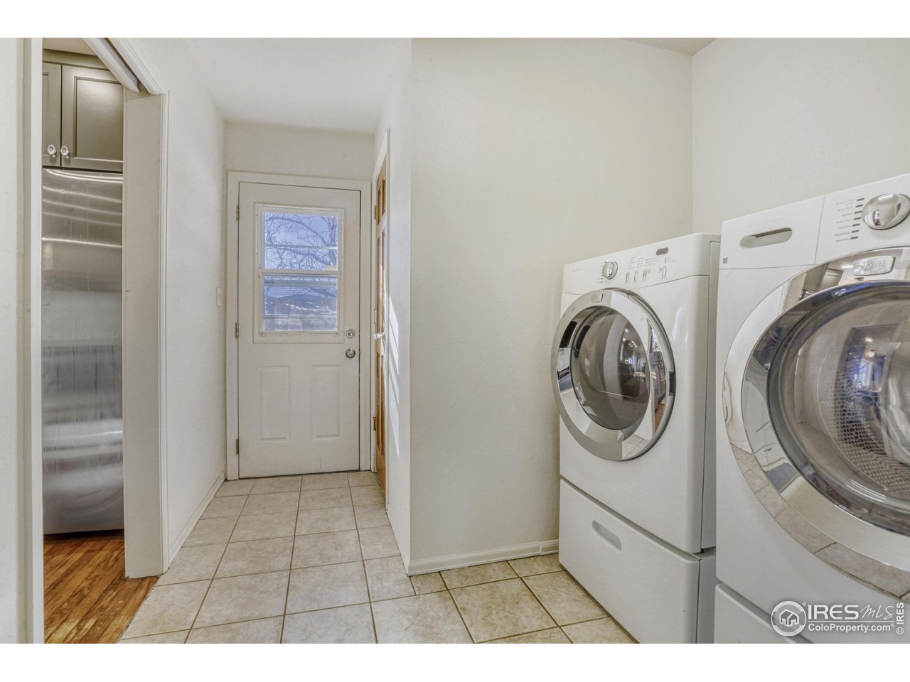 6921 Ridge Valley Court Loveland, CO 80538 - Photo 24 of 50 a view of a storage & utility room with washer and dryer