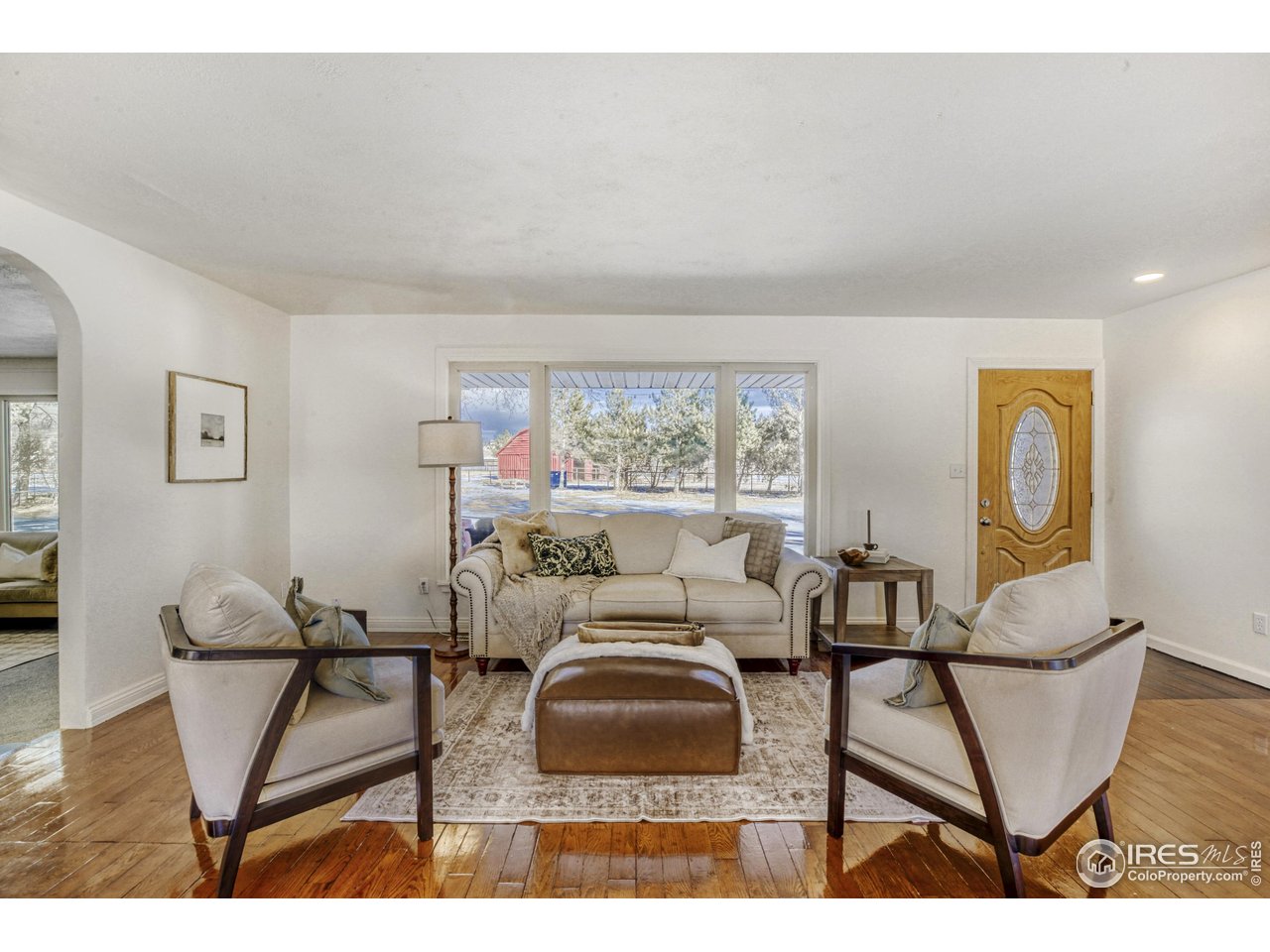 6921 Ridge Valley Court Loveland, CO 80538 - Photo 5 of 50 a living room with furniture and a window