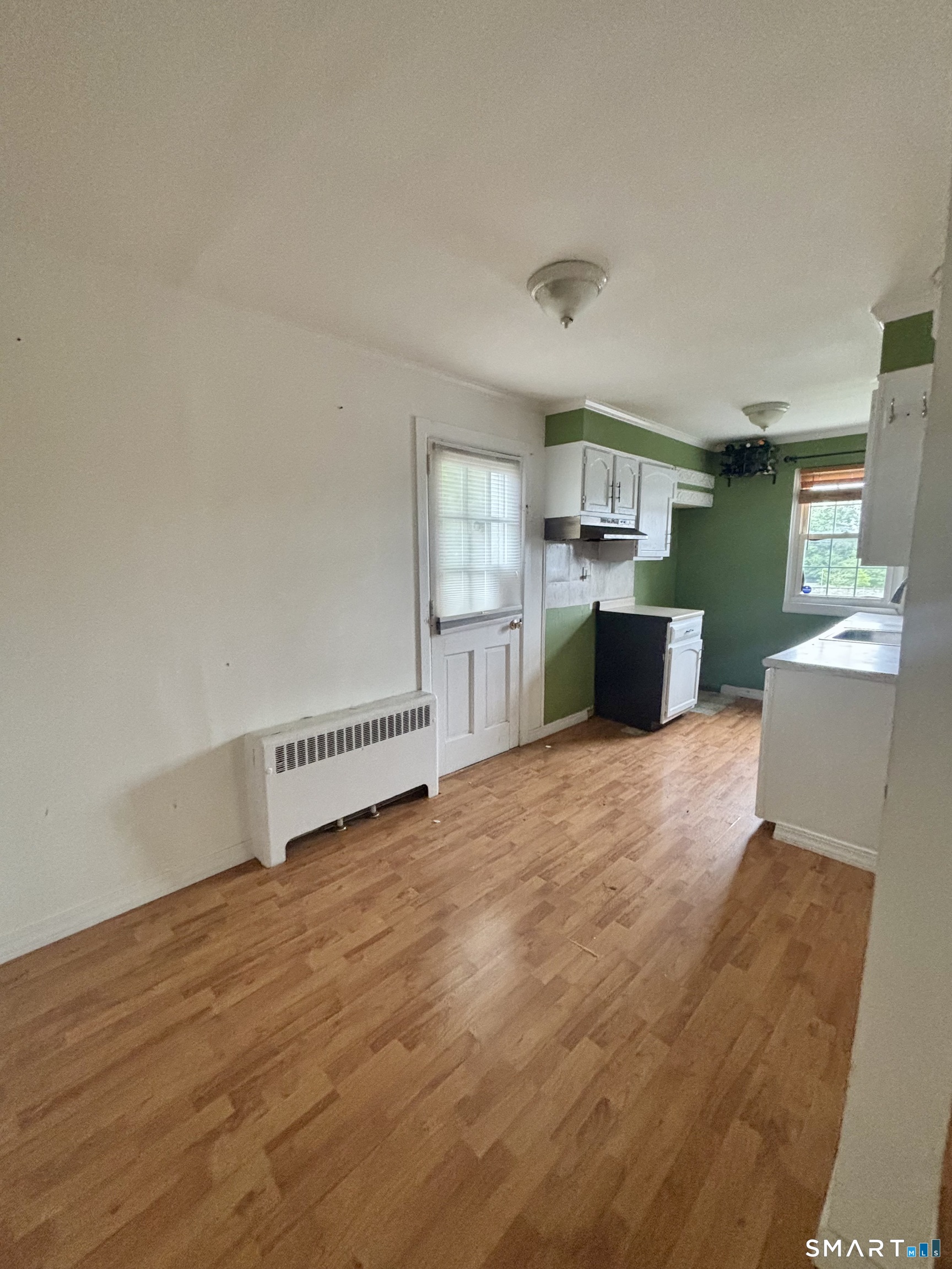 74 Standish Road, Unit 3 Stamford, CT 06902 - Photo 9 of 22 a living room with furniture and a kitchen