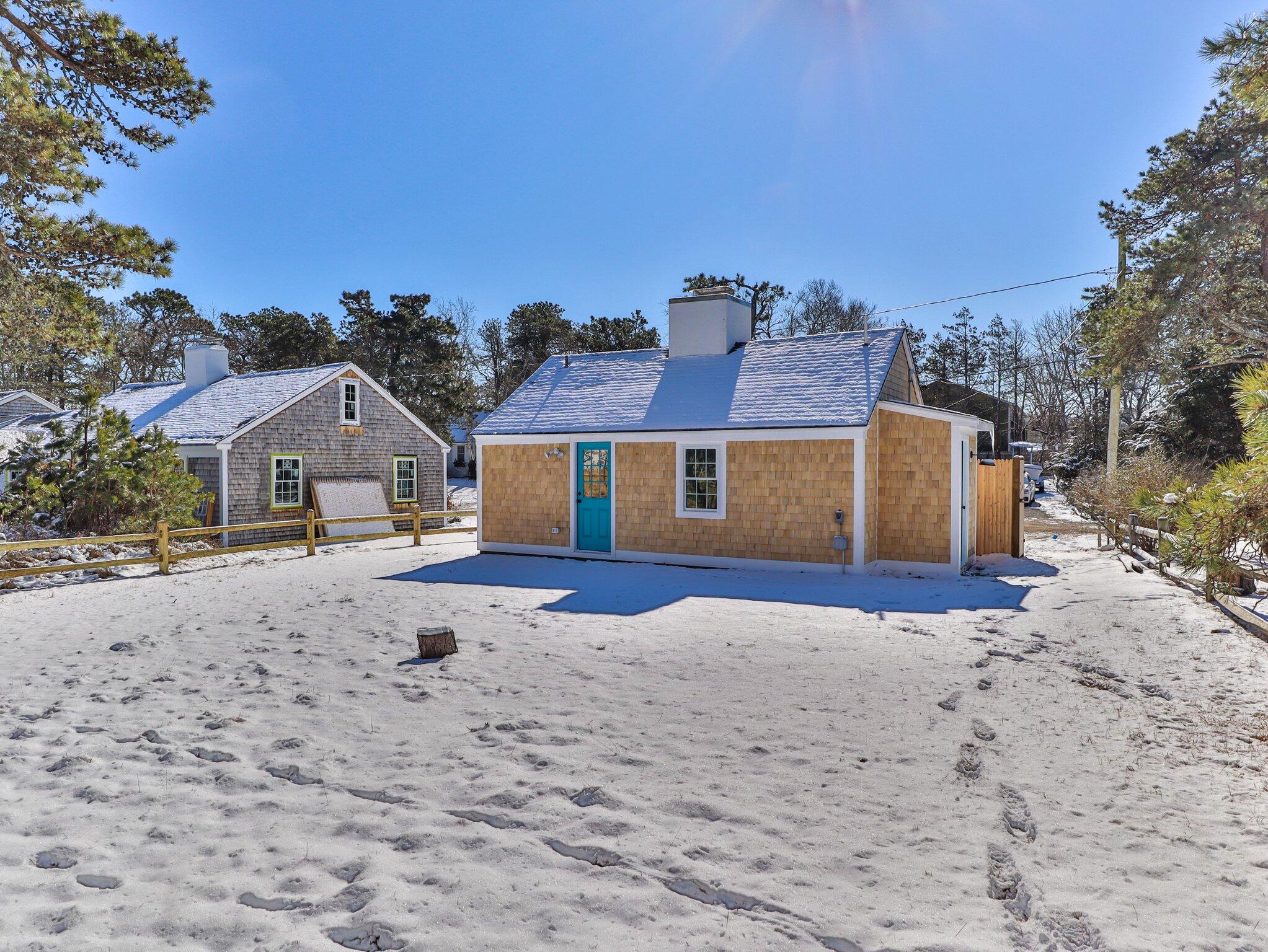 10 Heintz Road Dennis Port, MA 02639 - Photo 14 of 15 a front view of a house with a yard