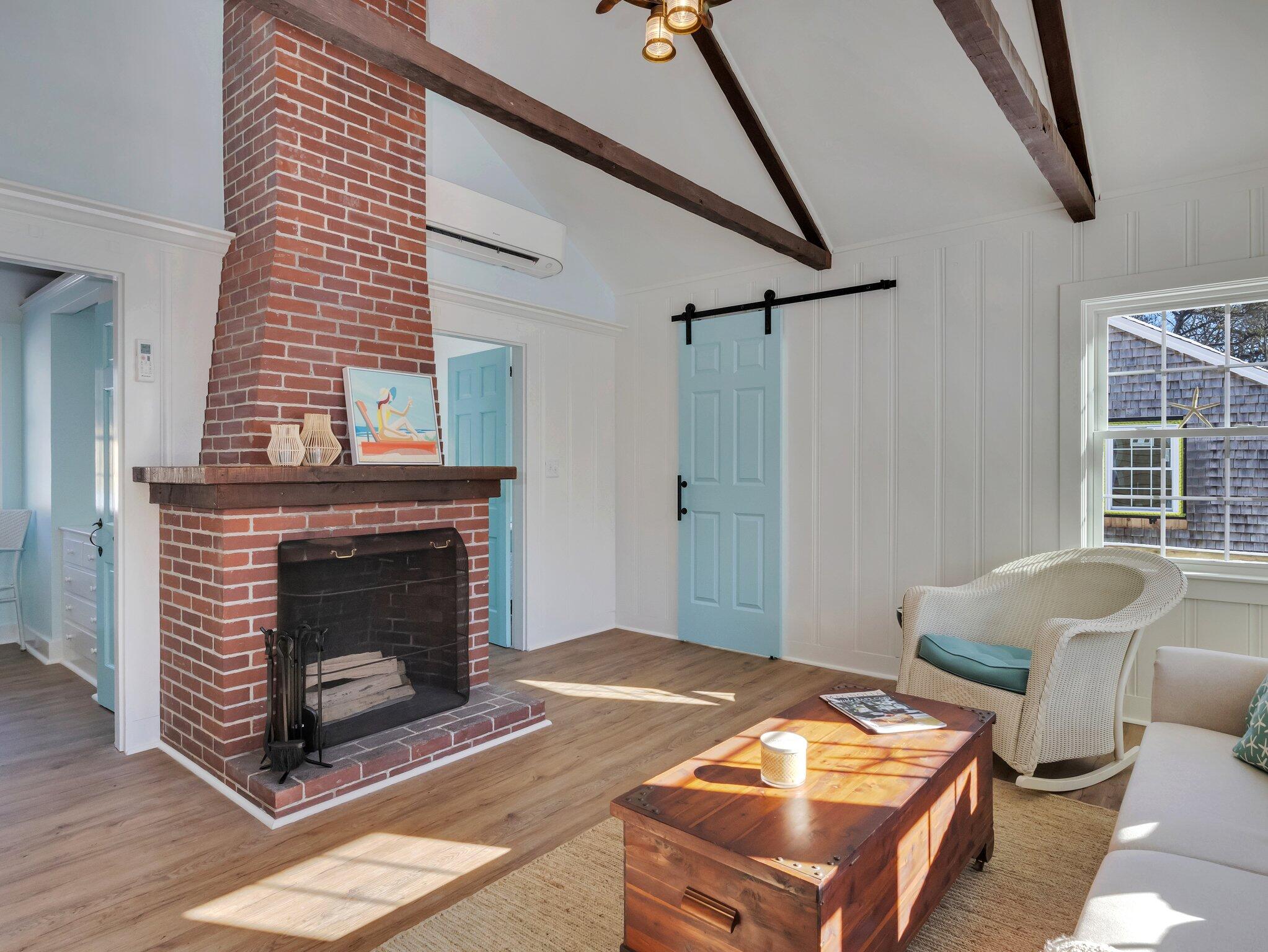 10 Heintz Road Dennis Port, MA 02639 - Photo 3 of 15 a living room with furniture and a fireplace