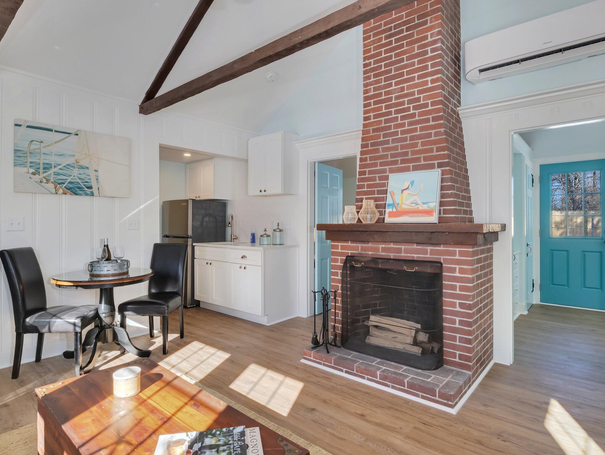10 Heintz Road Dennis Port, MA 02639 - Photo 5 of 15 a living room with furniture a fireplace and a table