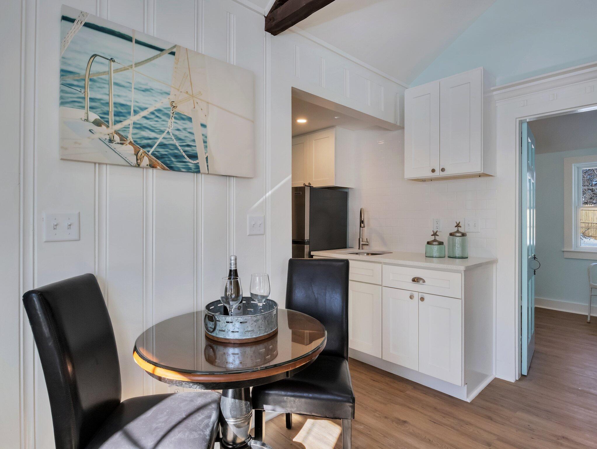 10 Heintz Road Dennis Port, MA 02639 - Photo 6 of 15 a kitchen with a dining table and chairs